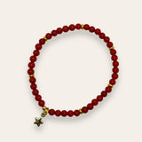 Jul Armbånd Red Bamboo Coral med gullfarget rondeller og stjerne charms