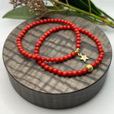 Jul: Armbånd Red Bamboo Coral med gullfarget kule